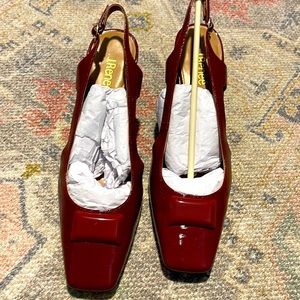 Beautiful excellent condition like new. Worn once. Burgundy red.